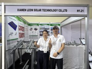 Leon Solar team giving thumbs up at booth H1.21 during Solar & Storage Live Nigeria in Lagos