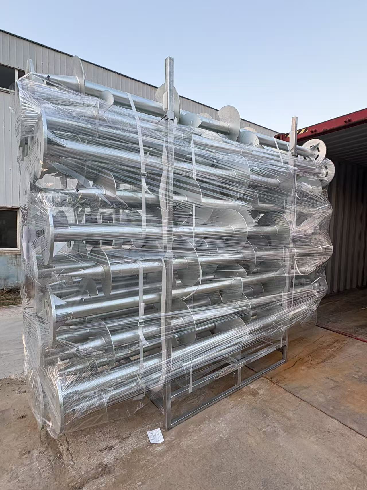 Custom spiral ground piles packed in reinforced palletized bundles ready for container shipment